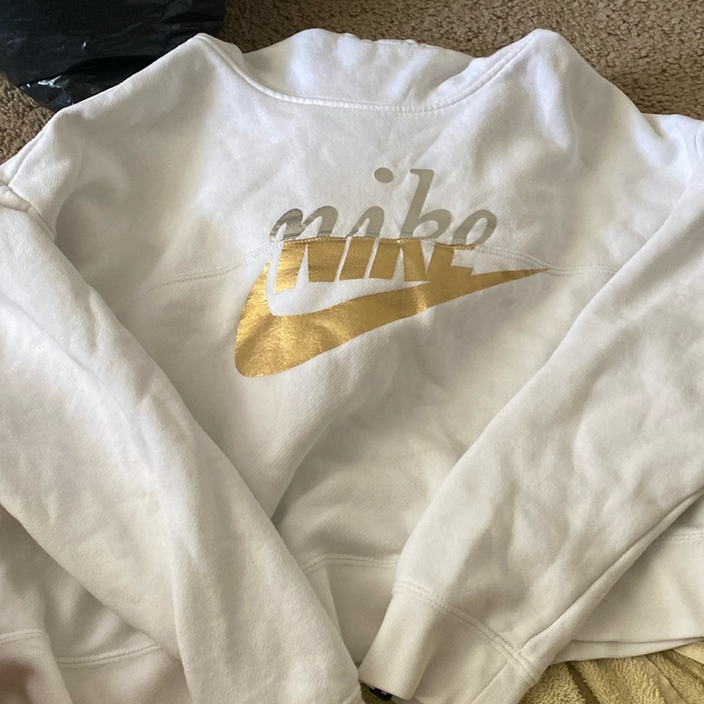 White knife hoodie with gold and silver writing